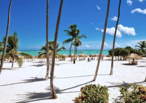 Fully renovated Beachfront 1BR Condo in the gated Stanza Mare community with a private beach, pool, onsite restaurant and modern amenities such as refrigerator, dishwasher, filtered water, microwave, 